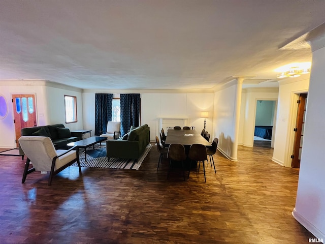 385 3rd St, Omaha, IL 62871 - living area with wood finished floors and decorative columns