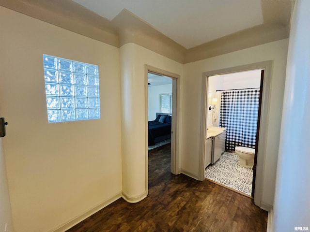 385 3rd St, Omaha, IL 62871 - hall featuring dark wood finished floors and baseboards