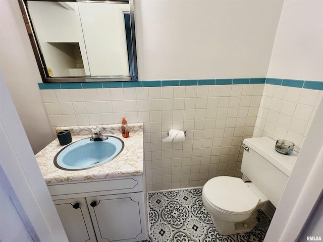 385 3rd St, Omaha, IL 62871 - half bathroom featuring vanity, tile walls, and tile patterned floors