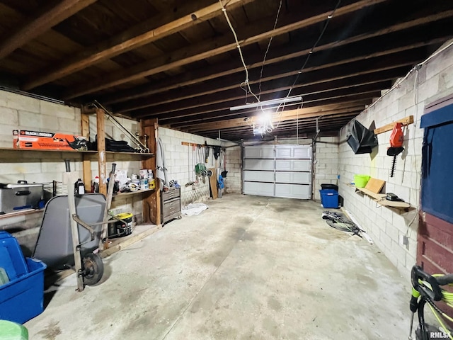 385 3rd St, Omaha, IL 62871 - garage featuring concrete block wall