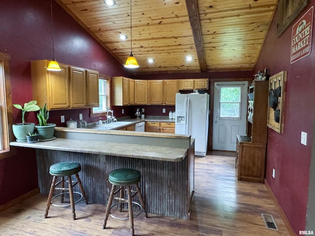 339 Spring St, Dongola, IL 62926 - kitchen with white appliances, vaulted ceiling, a peninsula, wooden ceiling, and light wood-style flooring