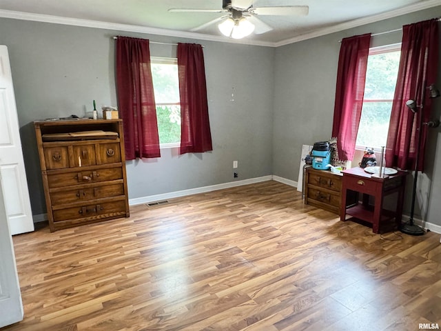 339 Spring St, Dongola, IL 62926 - bedroom featuring crown molding, multiple windows, wood finished floors, and ceiling fan