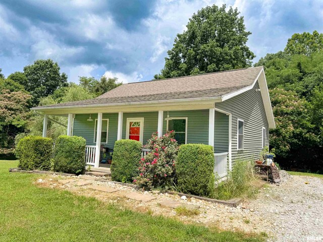 339 Spring St, Dongola, IL 62926 - view of front of property featuring covered porch and a front lawn