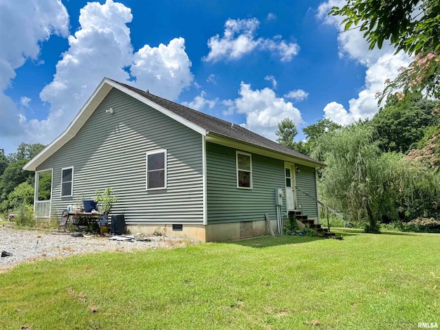 339 Spring St, Dongola, IL 62926 - view of property exterior with a lawn, entry steps, and crawl space