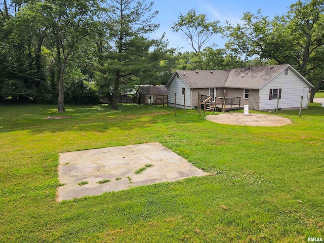 1130 W Webster St, Benton, IL 62812 - view of green lawn with a patio, a deck, and a shed