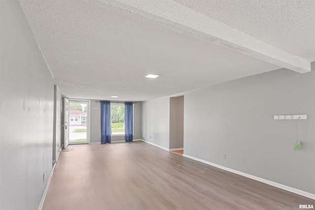 1130 W Webster St, Benton, IL 62812 - unfurnished room with a textured ceiling and wood finished floors