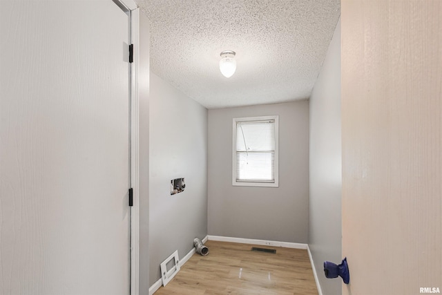 1130 W Webster St, Benton, IL 62812 - washroom featuring hookup for a washing machine, a textured ceiling, and light wood finished floors