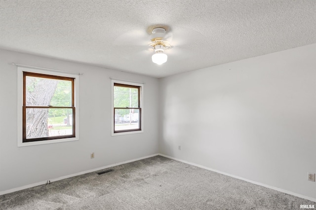 1130 W Webster St, Benton, IL 62812 - spare room featuring carpet floors, a textured ceiling, and ceiling fan