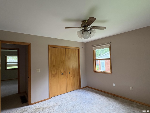 822 N 24th St, Murphysboro, IL 62966 - unfurnished bedroom with a closet, carpet floors, and ceiling fan