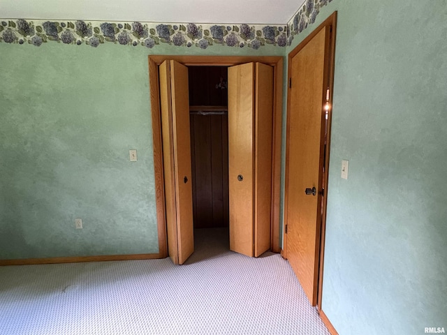 822 N 24th St, Murphysboro, IL 62966 - unfurnished bedroom with a closet and light colored carpet