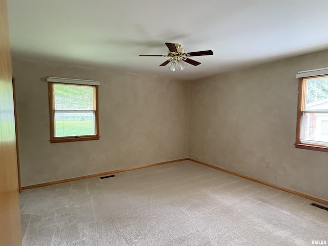 822 N 24th St, Murphysboro, IL 62966 - empty room with light colored carpet and a ceiling fan