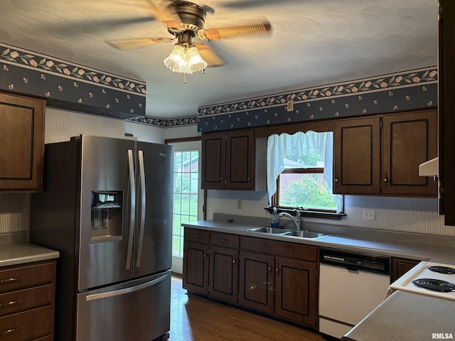 822 N 24th St, Murphysboro, IL 62966 - kitchen featuring white appliances, healthy amount of natural light, dark wood-style floors, and a ceiling fan
