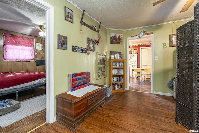 402 S Clay St, Sesser, IL 62884 - hall featuring wood finished floors, ornamental molding, and a textured ceiling