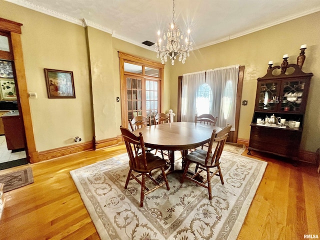 850 Joppa N Ave, Joppa, IL 62953 - dining space featuring a chandelier, light wood-style floors, and crown molding