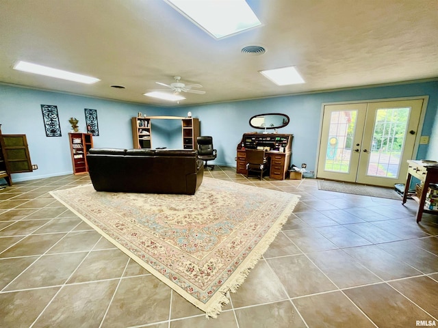 850 Joppa N Ave, Joppa, IL 62953 - living area featuring tile patterned flooring, french doors, ceiling fan, and a skylight