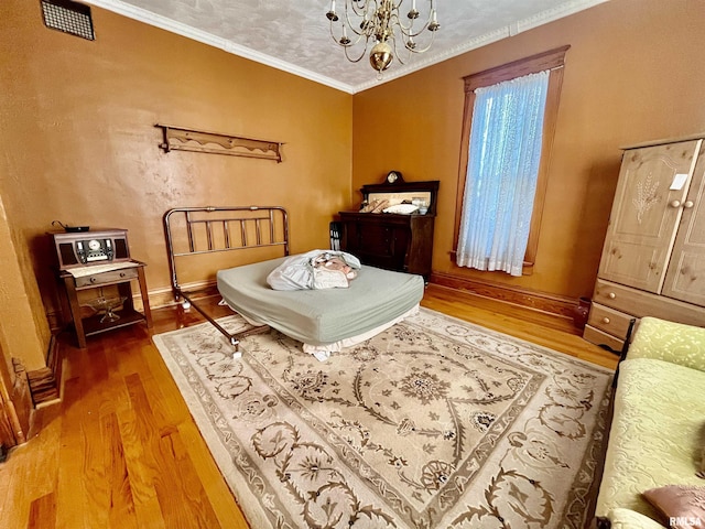 850 Joppa N Ave, Joppa, IL 62953 - bedroom featuring wood finished floors, a chandelier, and ornamental molding