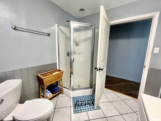 850 Joppa N Ave, Joppa, IL 62953 - bathroom featuring a stall shower, tile patterned floors, tile walls, a wainscoted wall, and vanity
