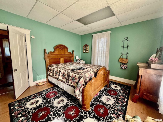 850 Joppa N Ave, Joppa, IL 62953 - bedroom featuring a drop ceiling and wood finished floors
