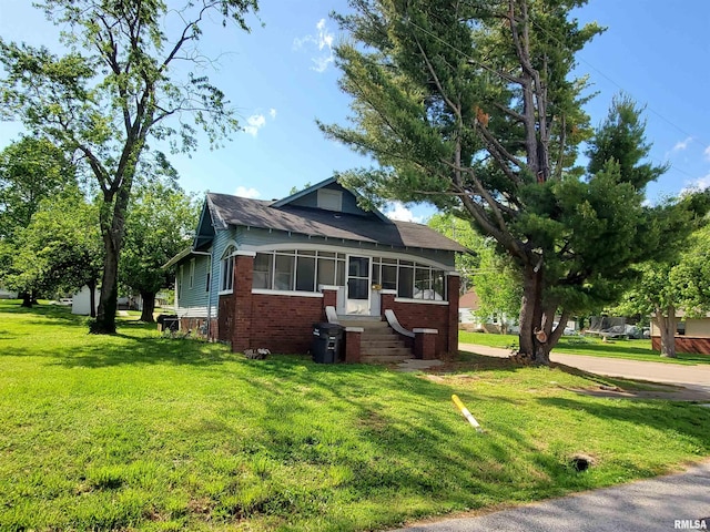 724 N Carico St, Carbondale, IL 62901 - view of front of home featuring brick siding, a front yard, and entry steps