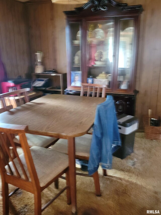 1060 W 5th St, Flora, IL 62839 - carpeted dining room with wood walls