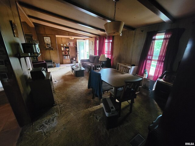 1060 W 5th St, Flora, IL 62839 - dining area featuring wood walls and carpet floors