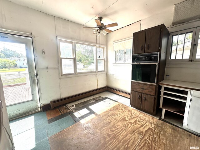 321 S Maple St, Centralia, IL 62801 - kitchen featuring black oven, plenty of natural light, ceiling fan, and dark brown cabinets