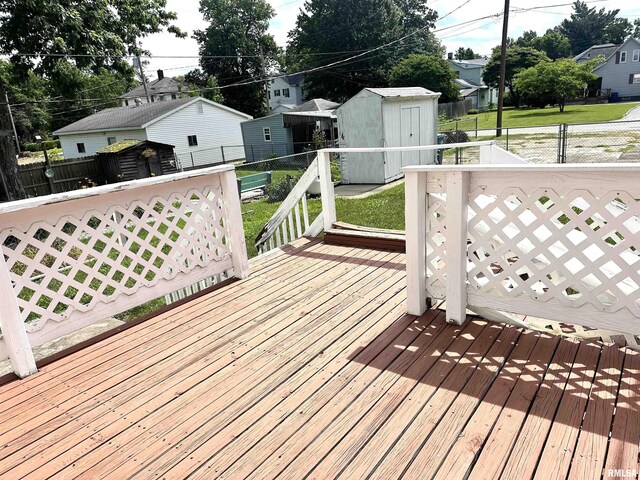 321 S Maple St, Centralia, IL 62801 - wooden terrace with a storage shed, a fenced backyard, and a residential view