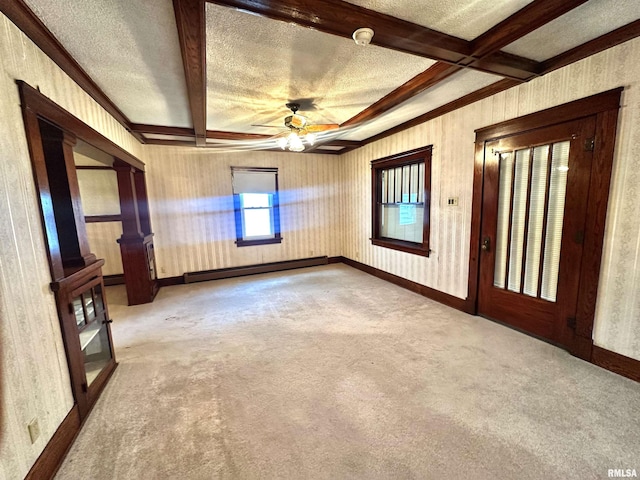 321 S Maple St, Centralia, IL 62801 - empty room with a baseboard heating unit, carpet flooring, beam ceiling, ceiling fan, and a textured ceiling