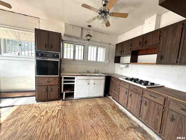 321 S Maple St, Centralia, IL 62801 - kitchen with oven, gas stovetop, a ceiling fan, and healthy amount of natural light