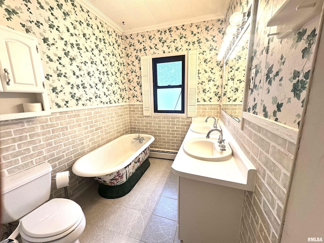 321 S Maple St, Centralia, IL 62801 - full bathroom with crown molding, wallpapered walls, a soaking tub, wainscoting, and double vanity