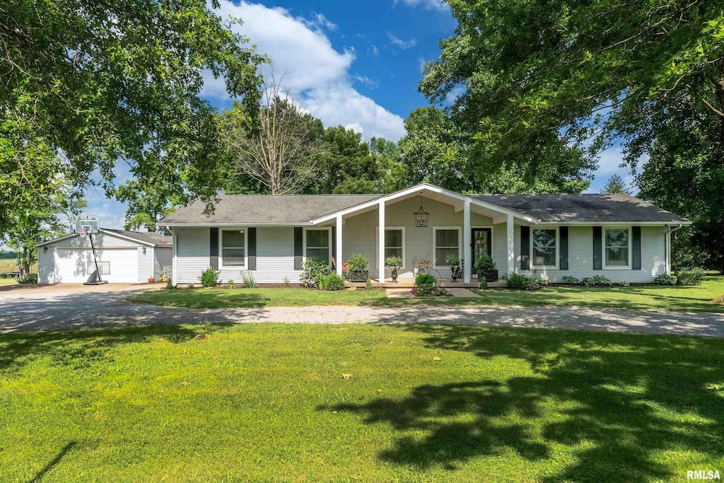 1801 Old Creal Springs Rd, Marion, IL 62959 - single story home featuring a porch, a detached garage, an outdoor structure, and a front yard