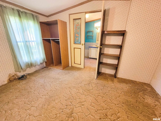 235 W 8th St, Flora, IL 62839 - unfurnished bedroom with crown molding, wallpapered walls, carpet, and a closet
