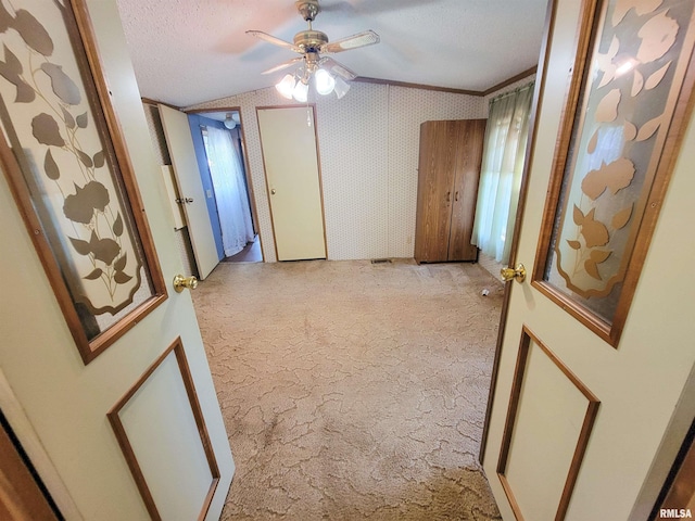 235 W 8th St, Flora, IL 62839 - corridor featuring vaulted ceiling, light colored carpet, and a textured ceiling