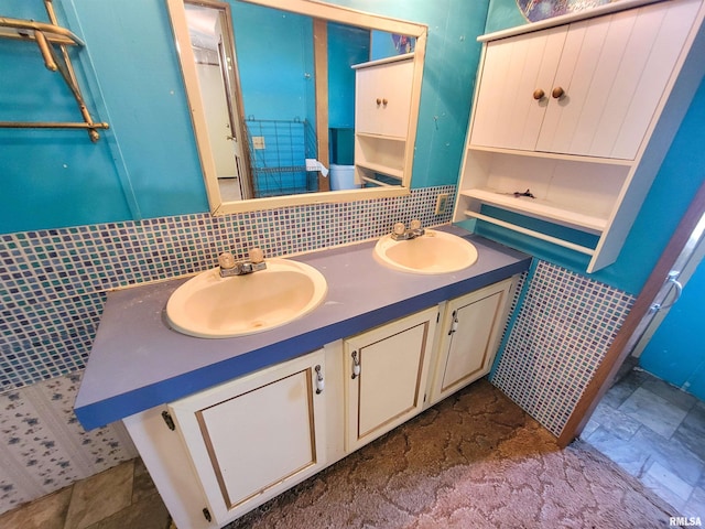 235 W 8th St, Flora, IL 62839 - bathroom featuring double vanity and backsplash