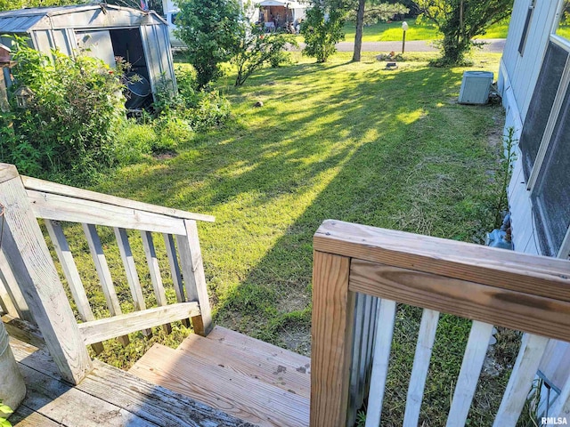 235 W 8th St, Flora, IL 62839 - view of green lawn with a storage shed