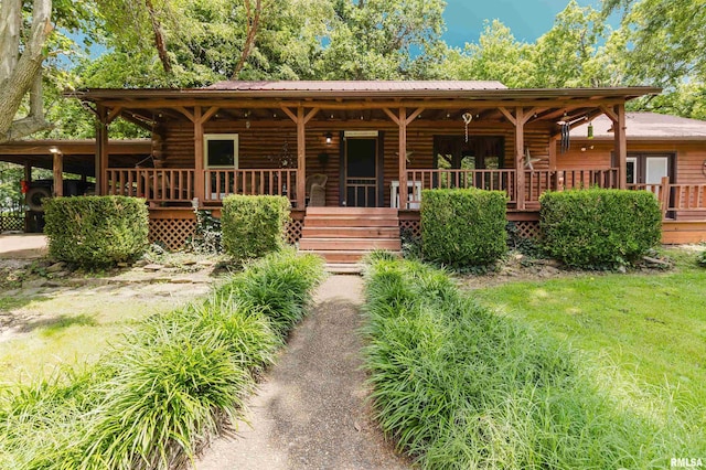 690 Ganntown Ln, Grantsburg, IL 62943 - log cabin featuring a porch and log siding