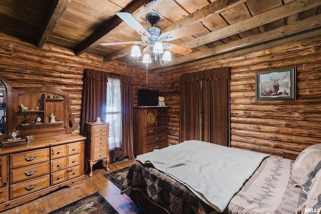 690 Ganntown Ln, Grantsburg, IL 62943 - bedroom featuring a wood ceiling with exposed beams, log walls, hardwood / wood-style flooring, and ceiling fan