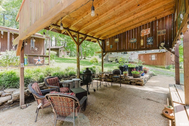 690 Ganntown Ln, Grantsburg, IL 62943 - view of patio with an outbuilding and a grill