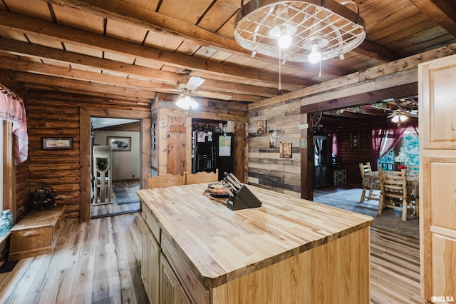 690 Ganntown Ln, Grantsburg, IL 62943 - kitchen with butcher block countertops, light wood-style flooring, a wood ceiling with exposed beams, wooden walls, and ceiling fan