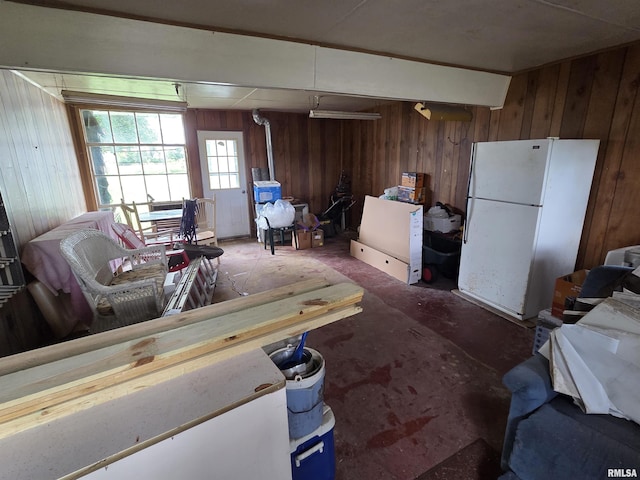 2316 W Main St, Salem, IL 62881 - living area featuring wood walls, a wood stove, and concrete flooring