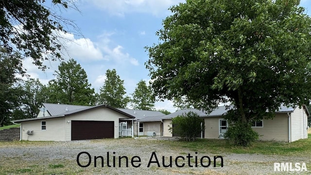 3100 Ava Rd, Murphysboro, IL 62994 - ranch-style home with an attached garage and gravel driveway