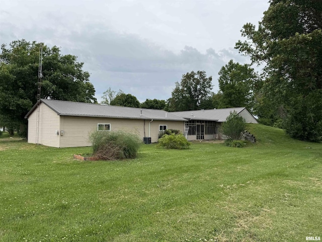 3100 Ava Rd, Murphysboro, IL 62994 - back of house with a yard, a sunroom, and a metal roof