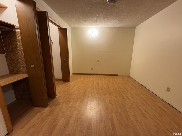 3100 Ava Rd, Murphysboro, IL 62994 - basement with light wood finished floors and a textured ceiling