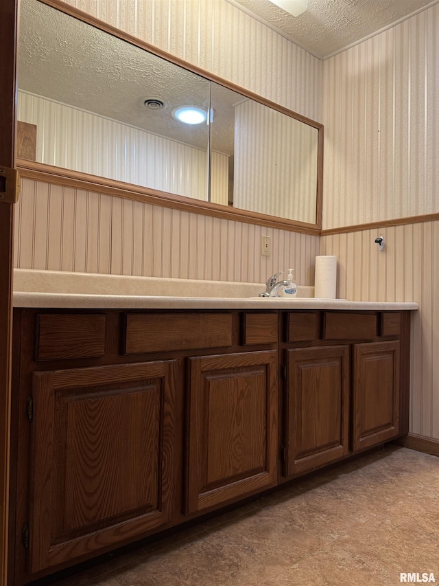 3100 Ava Rd, Murphysboro, IL 62994 - bathroom with a textured ceiling and vanity