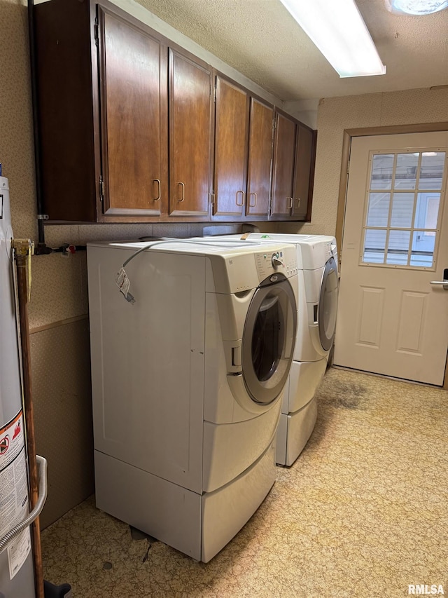 3100 Ava Rd, Murphysboro, IL 62994 - laundry room with separate washer and dryer, cabinet space, wallpapered walls, and water heater