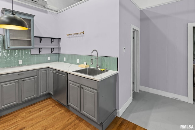 6 S Division St, Duquoin, IL 62832 - kitchen with gray cabinets, stainless steel dishwasher, tasteful backsplash, and light stone counters