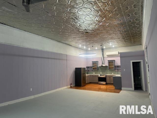 6 S Division St, Duquoin, IL 62832 - unfurnished living room with an ornate ceiling and a wall unit AC