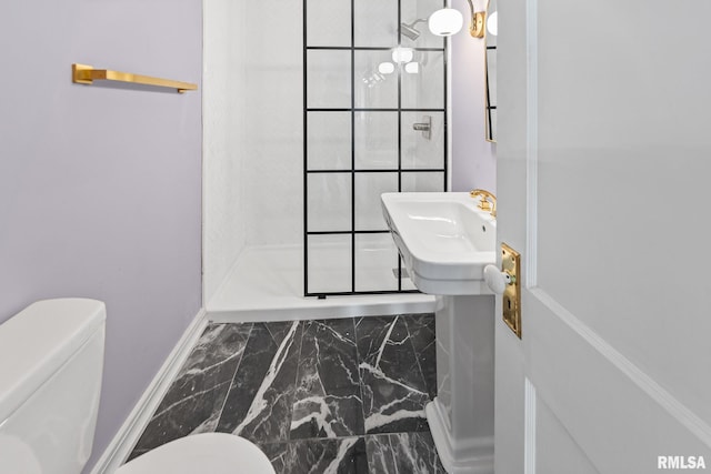 6 S Division St, Duquoin, IL 62832 - bathroom featuring marble finish flooring and a shower stall