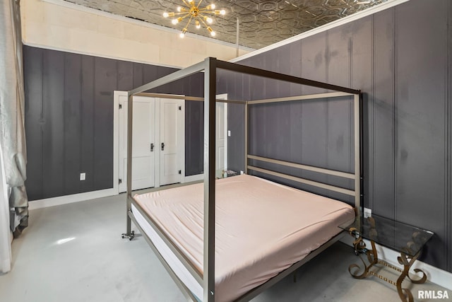 6 S Division St, Duquoin, IL 62832 - bedroom with an ornate ceiling, concrete floors, and a chandelier