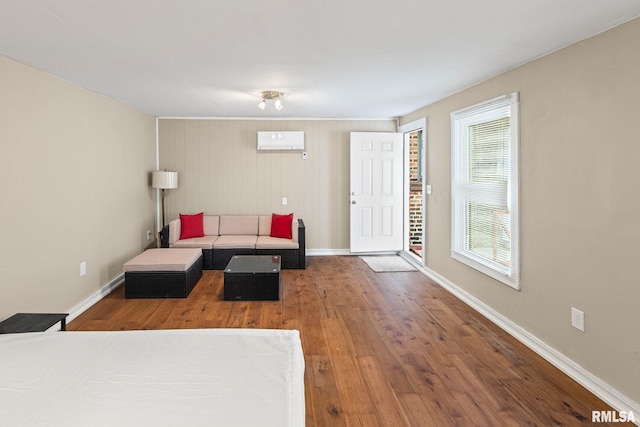 6 S Division St, Duquoin, IL 62832 - living area featuring a wall mounted AC and wood finished floors